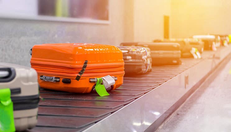 luggage on conveyor belt in the airport